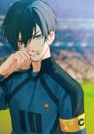  1boy armband blood blood_on_face blue_lock blurry blurry_foreground dekkaimabushi fingernails green_eyes green_hair high_collar highres itoshi_rin looking_at_viewer male_focus short_hair soccer_uniform solo sportswear sweat teeth twitter_username upper_body wiping_blood 