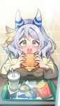  1girl animal_ears blush breasts brown_eyes burger casual commentary_request cup disposable_cup drinking_straw ear_covers ear_ornament food french_fries grey_eyes grey_hair hair_between_eyes hair_ornament highres hishi_miracle_(umamusume) holding holding_food horse_ears horse_girl looking_at_viewer medium_breasts medium_hair open_mouth reversi_(reversi_ppp) sandwiched solo surprised table teeth tray umamusume upper_teeth_only 