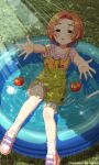  1girl :o absurdres blush collarbone forehead grass highres hmax idolmaster idolmaster_cinderella_girls light_rays looking_at_viewer outdoors overall_shorts overalls parted_bangs reaching reaching_towards_viewer ryuzaki_kaoru solo tomato wading_pool water water_drop wet wet_clothes wet_hair yellow_overalls 