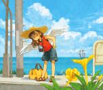  1girl bag blue_shorts blue_sky bracelet brown_eyes brown_hair camera camera_around_neck closed_mouth cloud day duffel_bag feathered_wings flower hat jewelry medium_hair monaka_(siromona) orange_shirt original outdoors sandals shirt shorts sky smile solo straw_hat tank_top wings 