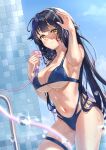  1girl alternate_costume azuma_(azur_lane) azur_lane bikini black_hair blue_bikini breasts highres large_breasts light_smile long_hair looking_at_viewer multi-strapped_bikini navel shower_head showering swimsuit thigh_strap tile_wall tiles very_long_hair wet wet_hair xlewez yellow_eyes 