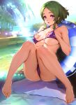 1girl barefoot bikini blurry blurry_background breasts commentary_request day feet green_hair gundam gundam_suisei_no_majo hand_under_clothes hand_under_swimsuit highres knees_up large_breasts looking_at_viewer maisie_may outdoors oyaman palm_tree parted_bangs parted_lips poolside purple_bikini purple_eyes short_hair sitting solo sunlight swimsuit toes tree twitter_username 