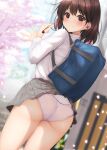  1girl accidental_exposure ass bag brown_eyes brown_hair carrying_bag cherry_blossoms closed_mouth clothes_lift from_behind grey_skirt in-ear_earphones long_sleeves looking_at_viewer looking_back minato_ojitan original panties petals pleated_skirt school_bag school_uniform shirt shirt_tucked_in short_hair skirt skirt_lift smile standing underwear white_panties white_shirt 