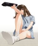  1girl brown_eyes brown_hair choppy_bangs controller feet foreshortening full_body grey_shirt holding holding_remote_control knee_up leg_up legs looking_at_viewer mattaku_mousuke medium_hair no_shoes one_eye_closed open_mouth original remote_control shirt shorts sidelocks simple_background sitting socks soles white_socks 