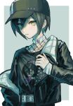  1boy alternate_costume belt black_headwear black_jacket blush border brown_eyes character_print collarbone cowboy_shot danganronpa_(series) danganronpa_v3:_killing_harmony fishnet_top fishnets green_background grey_belt hair_between_eyes highres jacket long_sleeves looking_at_viewer off_shoulder open_clothes open_jacket parted_lips print_shirt saihara_shuichi shirt solo teeth umeumeumestar white_border 