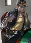  1boy artist_name belt black_coat black_hair black_pants card chain coat commentary_request danart14020 green_eyes hand_on_own_face hat highres holding holding_card jojo_no_kimyou_na_bouken kujo_jotaro lips looking_at_viewer male_focus multiple_belts muscular pants playing_card poker_table realistic school_uniform shirt sitting solo stardust_crusaders table watch wristwatch 