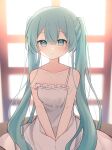  1girl absurdres arms_between_legs backlighting blue_eyes blue_hair blush chemise hatsune_miku highres long_hair looking_at_viewer parted_lips sitting solo strap_slip sunlight twintails very_long_hair vocaloid window yomiya_yumeha 