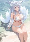  1girl animal_ear_fluff animal_ears arm_rest azur_lane beach bikini blue_eyes breasts cleavage closed_mouth detached_sleeves duosix_setsu0408 fox_ears fox_tail highres kitsune large_breasts long_hair looking_at_viewer mole mole_under_eye navel official_alternate_costume outdoors sand see-through see-through_sleeves shinano_(azur_lane) sitting smile solo stomach swimsuit tail water white_bikini white_hair white_tail 