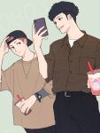  2boys afro backwards_hat belt black_hair black_headwear brown_shirt casual cellphone cup disposable_cup drinking_straw earrings green_background grin hakozume:_kouban_joshi_no_gyakushuu hat holding holding_cup jewelry male_focus minamoto_seiji multiple_boys necklace phone pocket red_hair shirt short_sleeves skyoskyo smartphone smile standing watch wristwatch yamada_takeshi 