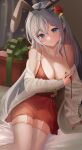  1girl :o absurdres animal_ears arm_support bare_shoulders bed_sheet blue_eyes blurry blurry_background blush breast_hold breasts christmas cleavage collarbone curtains dot_nose dress fake_animal_ears forehead garter_straps gift grey_hair head_tilt highres indoors jewelry large_breasts legs_together long_hair long_sleeves looking_at_viewer mole mole_under_eye nail_polish necklace off_shoulder original parted_lips red_dress red_nails shadow solo themaree thighhighs thighs wardrobe_malfunction white_sleeves white_thighhighs 