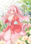  1girl blurry blurry_foreground bow breasts cleavage dress frilled_dress frilled_sleeves frills greenhouse hairband hanging_plant highres juliet_sleeves layered_dress lolita_hairband long_hair long_sleeves looking_at_viewer marian_oekaki original pink_eyes pink_hair plant puffy_sleeves smile solo sunlight two_side_up very_long_hair 