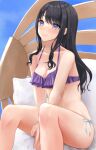  1girl arms_between_legs bikini black_hair blue_sky blush breasts cleavage collarbone feet_out_of_frame highres idolmaster idolmaster_shiny_colors kazano_hiori light_smile looking_at_viewer medium_breasts mismatched_bikini mole mole_under_mouth mossan_(mossan-777) purple_eyes side-tie_bikini_bottom sitting sky solo swimsuit 