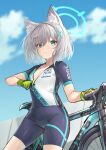  1girl animal_ear_fluff animal_ears beruu bicycle bike_shorts biker_clothes bikesuit black_shorts blue_archive blue_eyes blue_sky blurry bodysuit breasts collarbone commentary_request cross_hair_ornament depth_of_field gloves green_gloves grey_hair hair_between_eyes hair_ornament halo highres looking_at_viewer medium_breasts medium_hair mismatched_pupils official_alternate_costume outdoors parted_lips print_shirt shiroko_(blue_archive) shiroko_(cycling)_(blue_archive) shirt short_shorts short_sleeves shorts sidelocks sky solo two-tone_gloves wolf_ears wolf_girl zipper 