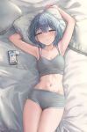 1girl airpods arms_up blue_eyes blue_hair blue_nails bra_strap breasts buruma cellphone envyvanity grey_buruma grey_camisole highres hololive hoshimachi_suisei lying navel official_alternate_hair_length official_alternate_hairstyle on_back parted_lips phone phone_screen pillow short_hair small_breasts smartphone solo star_(symbol) star_in_eye stomach symbol_in_eye thighs virtual_youtuber wireless_earphones 