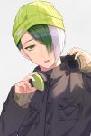 1boy be_imaro beanie black_jacket blue_lock character_request commentary_request green_eyes green_hair green_headwear grey_background hair_over_one_eye hat headphones headphones_around_neck highres jacket long_sleeves looking_at_viewer male_focus multicolored_hair parted_lips simple_background sleeves_past_wrists solo teeth two-tone_hair upper_body upper_teeth_only white_hair 