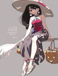  1girl bare_shoulders black_eyes black_hair broom broom_riding candy earrings food grey_background halloween hat highres jewelry long_hair long_skirt looking_at_viewer original sand side_slit skirt smile solo tennohi witch_hat 