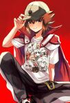  1boy black_pants blush brown_eyes brown_hair cape closed_mouth hair_between_eyes hand_on_headwear hat highres kuriboh looking_at_viewer male_focus pants red_background red_cape shirt shoes sitting sk816 solo spiked_hair t-shirt white_shirt yu-gi-oh! yu-gi-oh!_gx yuuki_juudai 