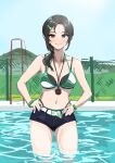  1girl absurdres aoki_kei belt bikini black_hair blue_shorts chain-link_fence collarbone denim denim_shorts fence green_bikini grin hands_on_own_hips highres idolmaster idolmaster_cinderella_girls looking_at_viewer micro_shorts navel outdoors pool shorts side_ponytail sketch smile solo stopwatch stopwatch_around_neck swimsuit trainer_(idolmaster) ushimochi wading 