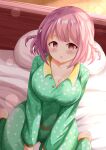  1girl barefoot bed blush braid breasts brown_eyes chestnut_mouth cleavage collarbone commentary_request green_pajamas green_pants green_shirt highres hoshizaki_akari large_breasts long_sleeves looking_at_viewer on_bed ongeki pajamas pants parted_lips pillow pink_hair polka_dot polka_dot_pajamas polka_dot_pants polka_dot_shirt shirt sitting solo twin_braids wariza zenon_(for_achieve) 