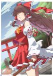  1girl absurdres ahoge blue_sky bow brown_hair chest_sarashi cloud commentary_request detached_sleeves feet_out_of_frame frilled_skirt frills hair_bow hair_tubes hakurei_reimu highres long_hair looking_at_viewer looking_to_the_side outdoors parted_lips red_bow red_shirt red_skirt ribbon-trimmed_skirt ribbon-trimmed_sleeves ribbon_trim sarashi shirt sidelocks skirt sky solo standing torii touhou tree yuuka_(a0240765) 