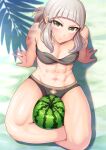  1girl abs absurdres bare_shoulders beach bikini black_bikini blunt_bangs breasts collarbone fate/grand_order fate_(series) food fruit grey_hair harurukan highres indian_style long_hair looking_at_viewer muscular muscular_female navel penthesilea_(fate) sand short_ponytail sidelocks sitting small_breasts solo swimsuit thighs toned watermelon yellow_eyes 