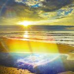  beach blue_sky cloud cloudy_sky horizon hoshiumisora light_rays morning no_humans ocean original rainbow reflection reflective_water sand scenery sky sun sunbeam sunlight sunrise water 