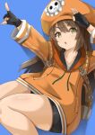  1girl :o absurdres backpack bag black_gloves black_shorts blue_background brown_hair cabbie_hat fingerless_gloves gloves guilty_gear guilty_gear_strive hat highres jacket long_hair looking_at_viewer may_(guilty_gear) open_mouth orange_headwear orange_jacket orutooon00 pointing pointing_up salute shorts skull_and_crossbones solo thighs yellow_eyes 