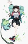  1girl ;d alternate_costume arm_behind_head belt black_headwear black_shorts brown_hair bulbasaur commentary_request falling_leaves green_jacket hair_flaps hat highres jacket kienai_11 knees leaf leaf_(pokemon) leg_up long_hair looking_at_viewer one_eye_closed open_clothes open_jacket open_mouth pokemon pokemon_(creature) pokemon_frlg red_belt shirt shoes shorts sidelocks smile teeth upper_teeth_only white_background zipper 