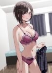  1girl bare_shoulders bed black_hair black_skirt blurry blurry_background bra chigusa_minori curtains futago_matomete_kanojo_ni_shinai? highres holding holding_clothes indoors lace lace_bra lace_panties looking_at_viewer multicolored_eyes navel official_art open_mouth panties red_bra red_panties short_hair skirt smile solo standing stomach underwear usami_hikari 
