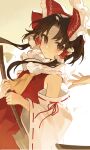  1girl ascot black_hair bow brown_eyes closed_mouth detached_sleeves hair_bow hair_tubes hakurei_reimu highres jill_07km long_hair looking_at_viewer parted_bangs red_bow red_shirt ribbon-trimmed_sleeves ribbon_trim shirt sidelocks solo touhou wide_sleeves yellow_ascot 