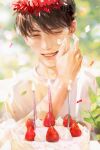  1boy birthday birthday_cake blurry bokeh brown_hair cake candle depth_of_field food hands_on_own_face highres icing jeong_taeui male.focus passion_(manhwa) ryeomiii smile solo strawberry_cake 