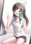  1girl absurdres airi_(blue_archive) baseball_bat black_shorts blue_archive brown_hair cellphone dolphin_shorts green_eyes hair_ornament hairclip halo highres holding holding_phone long_hair looking_at_viewer open_mouth paint_splatter phone shira_jun shirt shorts sitting smartphone smile solo w white_shirt 