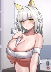  1girl absurdres alternate_breast_size animal_ear_fluff animal_ears arknights between_breasts blunt_bangs blurry blurry_background blush breasts cat_ears chinese_commentary cleavage closed_mouth commentary_request cross depth_of_field first_aid_kit greek_cross grey_hair hand_on_own_chest hand_up highres holding_strap huge_breasts indoors kal&#039;tsit_(arknights) long_hair looking_at_viewer sarashi shuibo solo upper_body yellow_eyes 