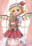  1girl absurdres back_bow bear blonde_hair bow bowtie collared_shirt crystal curtains flandre_scarlet frilled_skirt frills hat hat_ribbon high_meron highres indoors kneeling mob_cap no_shoes object_hug one_side_up open_mouth puffy_short_sleeves puffy_sleeves red_bow red_bowtie red_eyes red_ribbon red_skirt red_vest ribbon shirt short_hair short_sleeves skirt smile socks solo stuffed_animal stuffed_toy teddy_bear touhou vest white_bow white_headwear white_shirt white_socks window wings 