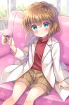  1girl blue_eyes blurry blurry_background blush brown_hair brown_shorts closed_mouth commentary_request couch cup day depth_of_field feet_out_of_frame haibara_ai hair_between_eyes highres holding holding_cup indoors kouta. lab_coat long_sleeves looking_at_viewer meitantei_conan mug on_couch open_clothes red_shirt shirt shorts sitting solo window 