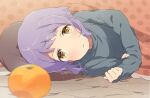  1girl black_sweater blush commentary dot_nose food fruit idolmaster idolmaster_million_live! kotatsu long_sleeves looking_at_another lying makabe_mizuki mandarin_orange mochigome_(ununquadium) parted_lips pillow polka_dot purple_hair short_hair sidelocks solo sweater table under_kotatsu under_table wavy_hair yellow_eyes 