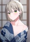  1girl bangs blonde_hair blue_kimono blurry blurry_background blush closed_mouth english_commentary floral_print highres japanese_clothes kimono looking_at_viewer mole mole_under_eye motto_notto original short_hair solo striped striped_kimono upper_body yellow_eyes 