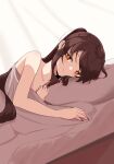  1girl absurdres bed_sheet black_nails brown_hair closed_mouth commentary_request genshin_impact highres hu_tao_(genshin_impact) jewelry long_hair lying nanana1218 on_bed on_side pillow ponytail red_eyes ring smile solo 