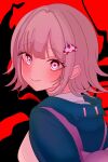  1girl black_background danganronpa_(series) danganronpa_2:_goodbye_despair flipped_hair galaga green_jacket hair_ornament highres hood hood_down jacket koeda_hina long_sleeves looking_at_viewer looking_back medium_hair nanami_chiaki pink_bag pink_eyes pink_hair red_background shirt smile solo white_shirt 