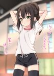  1girl arms_behind_head arms_up black_hair black_shorts black_thighhighs blurry blurry_background blush closed_mouth collarbone commentary_request depth_of_field dolphin_shorts green_eyes gym_shirt hair_between_eyes hair_ornament hairclip highres indoors long_hair looking_at_viewer original ponytail shirt short_shorts short_sleeves shorts sidelocks solo sweat takasuma_hiro thighhighs translation_request white_shirt 
