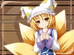  animal_ears blonde_hair fox_tail hat highres interlocked_fingers kazami_karasu long_sleeves multiple_tails pillow_hat short_hair smile solo tabard tail touhou wallpaper wide_sleeves yakumo_ran yellow_eyes 