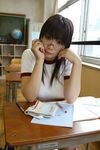  chocoball classroom desk glasses gym_uniform indoors photo real_life school_desk solo 