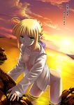  ahoge artoria_pendragon_(all) blonde_hair bottomless breasts fate/stay_night fate_(series) green_eyes lens_flare medium_breasts naked_shirt namonashi nipples ocean open_clothes open_shirt rock saber shirt solo sunset twilight wading water wet zanshomimai 