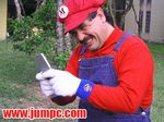  cosplay game_boy game_boy_advance game_boy_advance_sp handheld_game_console lowres male_focus mario mario_(series) photo solo super_mario_bros. 