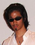  black_hair cosplay facial_hair goatee harima_kenji jewelry kobayashi_jin_(person) lowres male_focus mustache necklace photo real_life_insert school_rumble solo sunglasses 