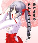  copyright_request hairdressing hakama japanese_clothes long_sleeves mika_mikan miko mouth_hold new_year red_hakama solo twintails 