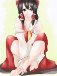 ascot bad_id bad_pixiv_id barefoot black_hair bow brown_eyes detached_sleeves face feet hair_bow hakurei_reimu hands_clasped hands_on_feet long_hair own_hands_together smile solo somsom touhou v_arms 
