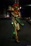  1girl arm_cannon cosplay metroid neon_trim nintendo photo pixel_ninja power_armor samus_aran varia_suit weapon 