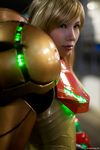  1girl blonde_hair cosplay metroid neon_trim nintendo photo pixel_ninja power_armor samus_aran varia_suit 