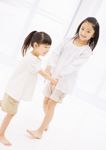  2girls absurdres asian barefoot child feet hand_holding happy highres japanese multiple_girls photo ponytail siblings sisters smile standing 